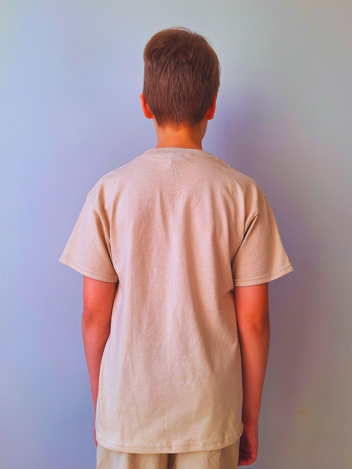 San’s Chronicles™ Official T-Shirt – Wear the Adventure! 🎉👕 Beige
