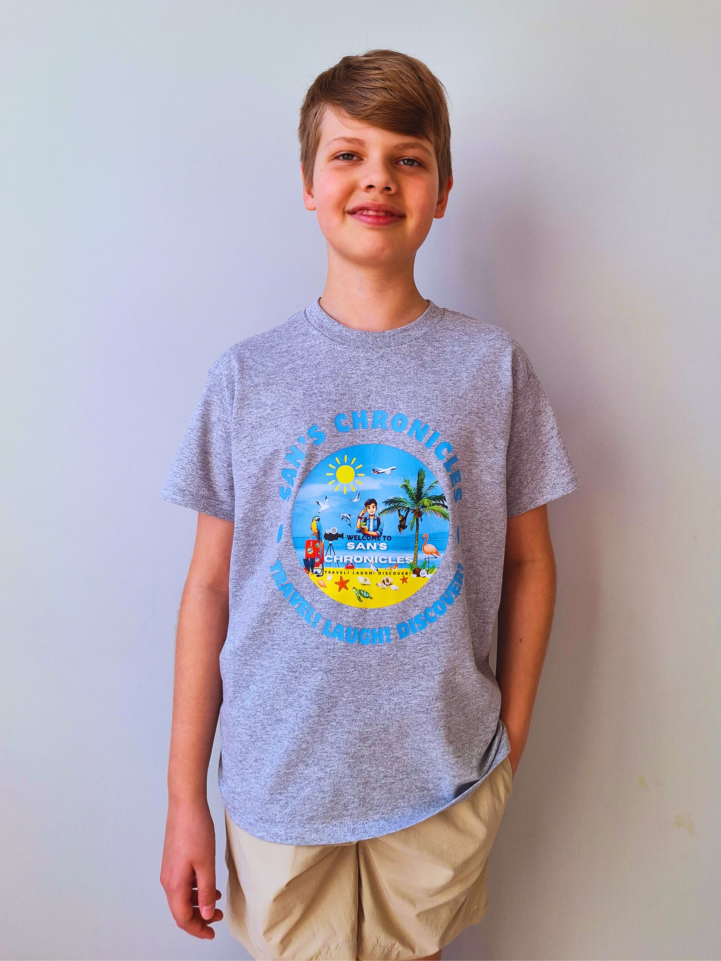 San’s Chronicles™ Official T-Shirt – Wear the Adventure! 🎉👕 Grey