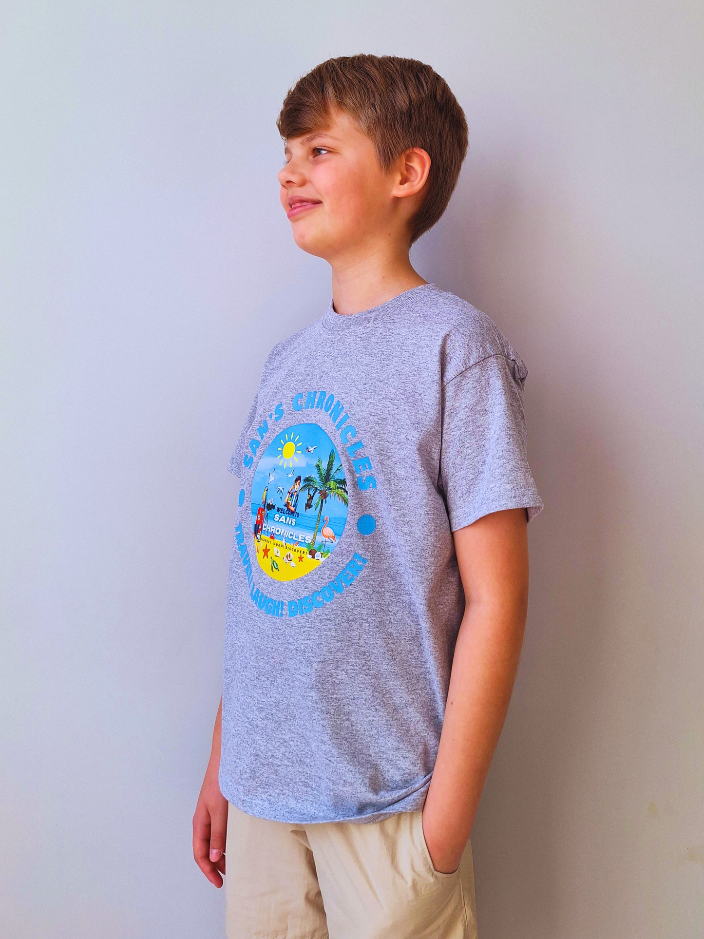 San’s Chronicles™ Official T-Shirt – Wear the Adventure! 🎉👕 Grey